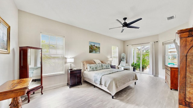 bedroom with light wood-style floors, baseboards, access to exterior, and a ceiling fan