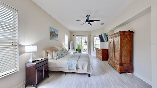bedroom with light wood finished floors, baseboards, access to exterior, and ceiling fan