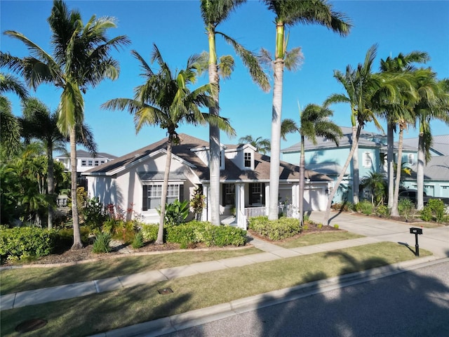 view of front of property featuring concrete driveway and a garage