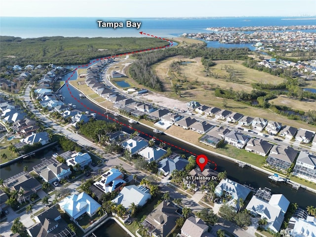 view of property location with a nearby body of water and nearby suburban area