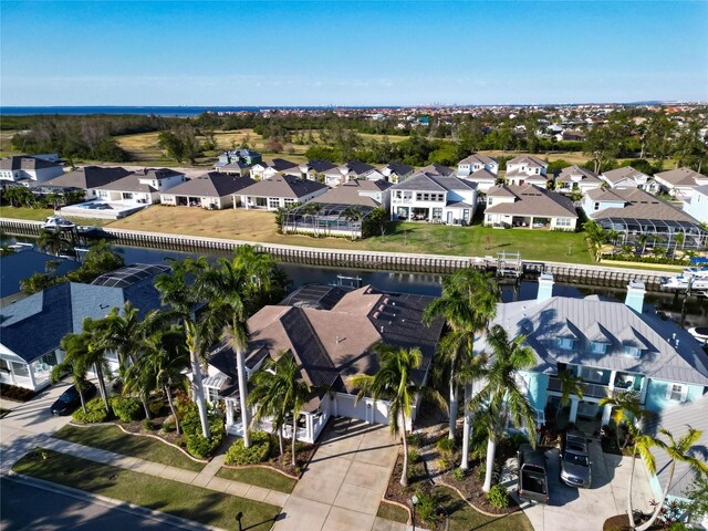 aerial perspective of suburban area featuring a nearby body of water