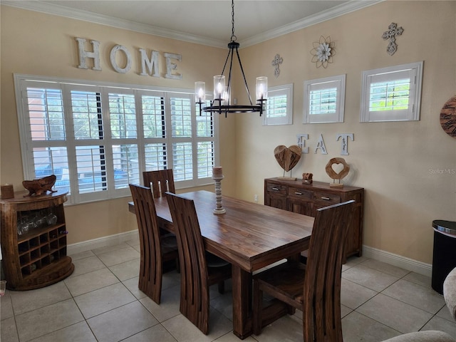 tiled dining area featuring ornamental molding, a healthy amount of sunlight, and a notable chandelier