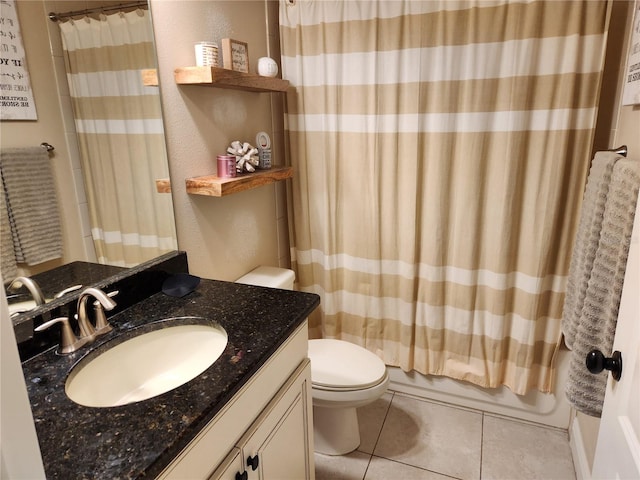 full bathroom featuring tile patterned flooring, vanity, toilet, and shower / bathtub combination with curtain