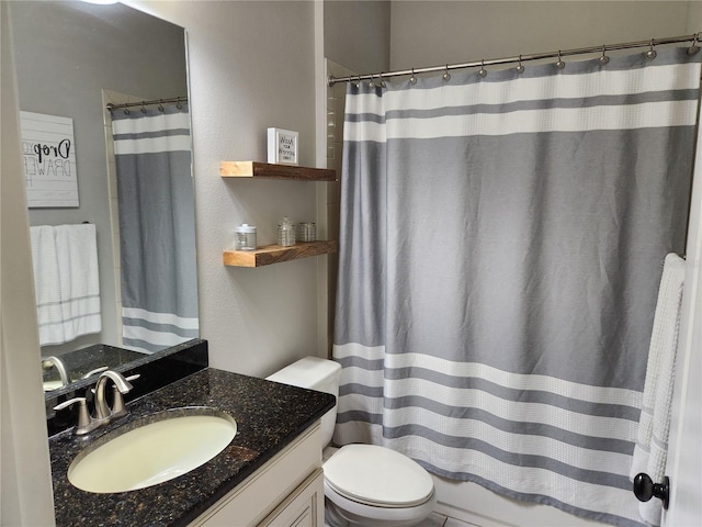 bathroom featuring vanity, toilet, and a shower with curtain