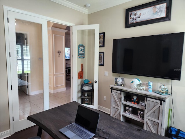 interior space with tile patterned flooring and ornamental molding