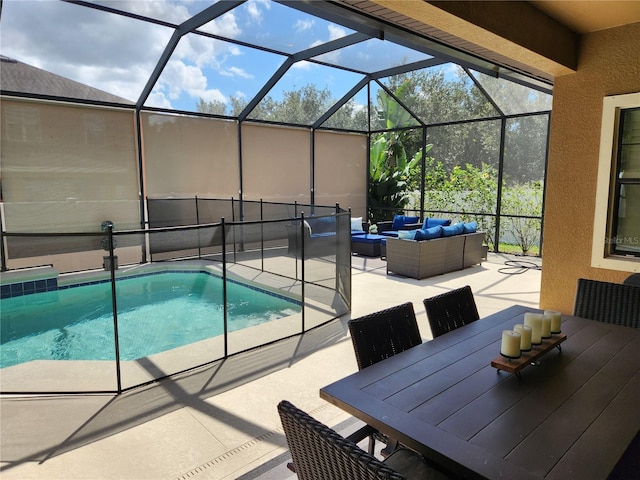 view of pool featuring outdoor lounge area, a lanai, and a patio