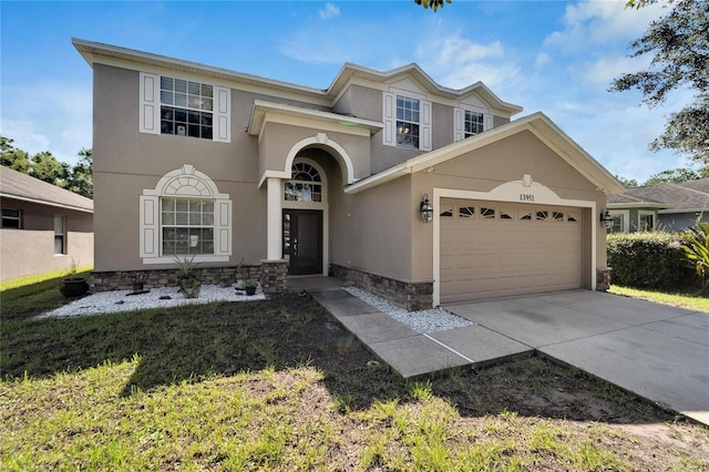 view of front of home with a garage and a front yard