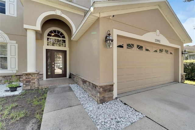 doorway to property with a garage