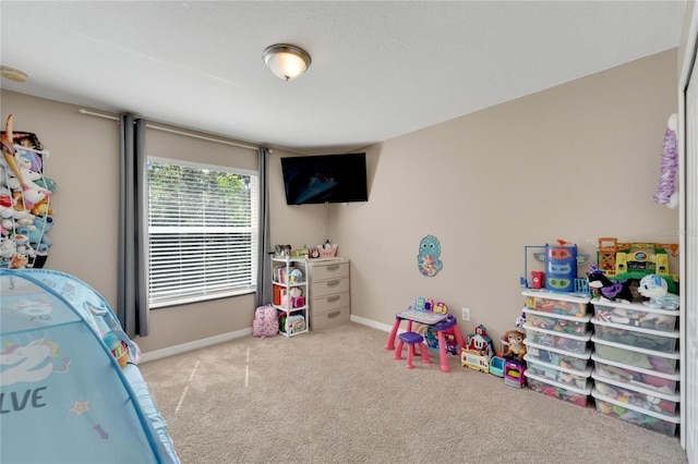 playroom featuring light carpet