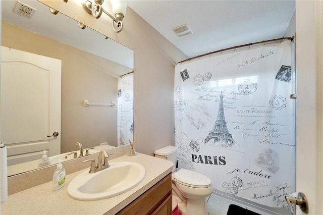 bathroom featuring a shower with shower curtain, toilet, and vanity