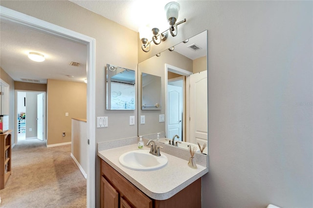 bathroom featuring vanity and a textured ceiling