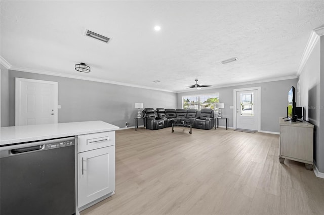 kitchen with visible vents, light wood-style flooring, ceiling fan, light countertops, and stainless steel dishwasher
