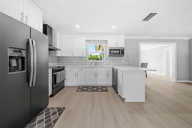 kitchen with visible vents, backsplash, a peninsula, stainless steel appliances, and wall chimney exhaust hood