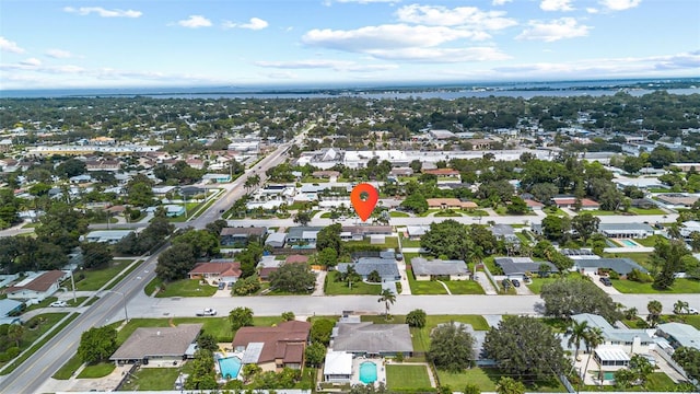 birds eye view of property with a residential view and a water view