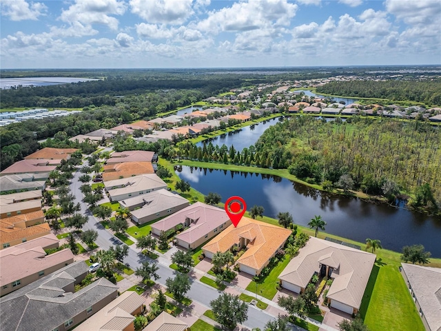 birds eye view of property with a water view