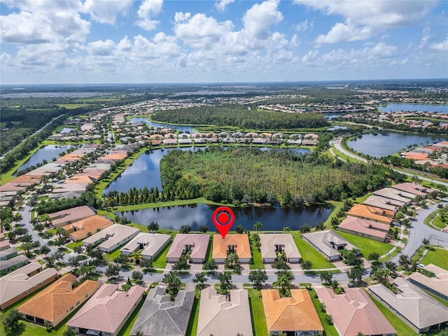 drone / aerial view with a water view and a residential view