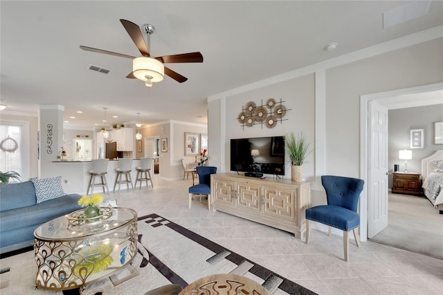 tiled living room featuring ceiling fan and crown molding