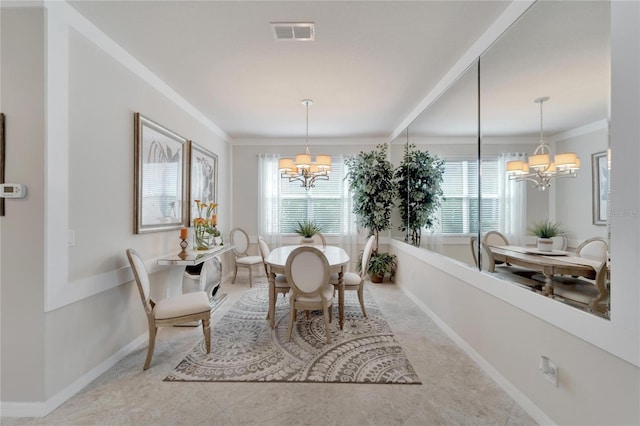 dining room with baseboards, a wealth of natural light, visible vents, and an inviting chandelier