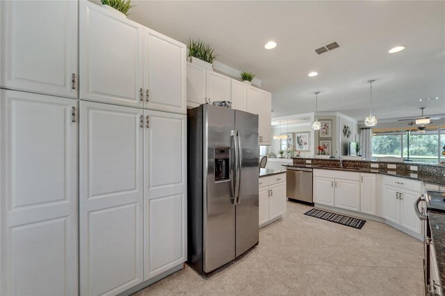 kitchen with visible vents, white cabinets, stainless steel appliances, pendant lighting, and recessed lighting