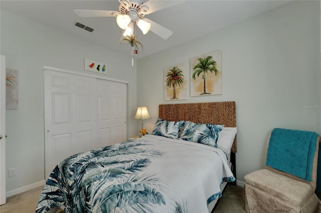 bedroom featuring light carpet, baseboards, visible vents, and a closet