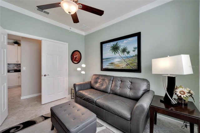 living room with ceiling fan and light tile patterned floors