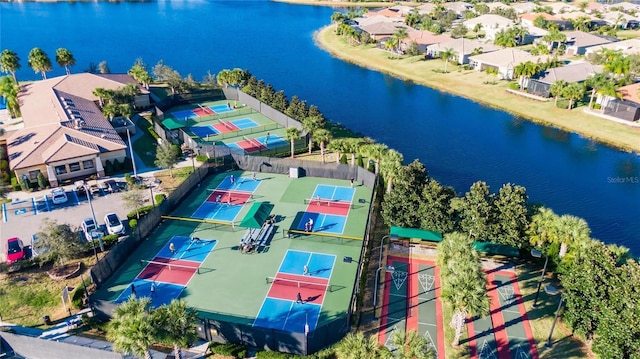 birds eye view of property with a water view and a residential view