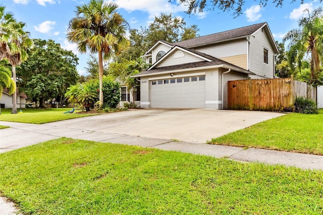 view of front facade featuring a front yard and a garage