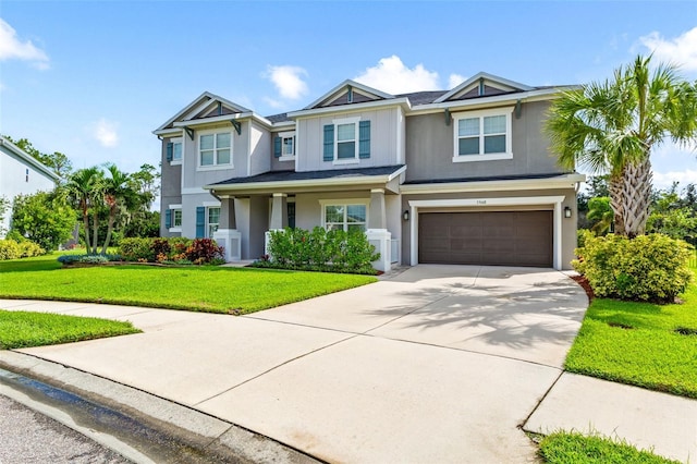 view of front of house featuring a front yard and a garage