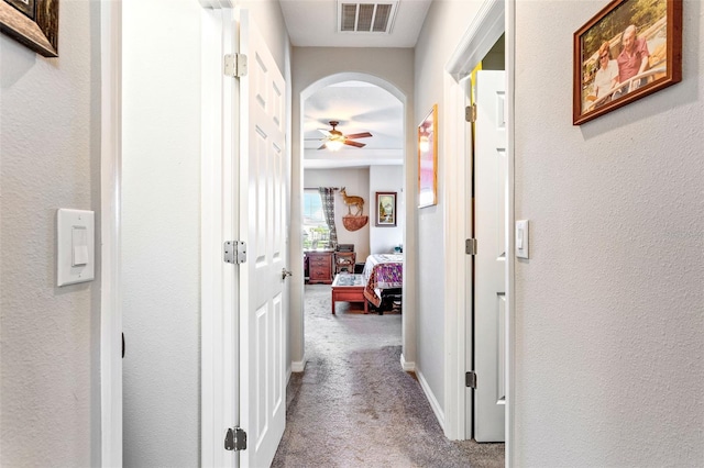 hallway with light carpet