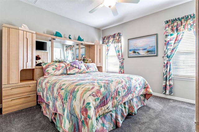 bedroom featuring dark carpet and ceiling fan