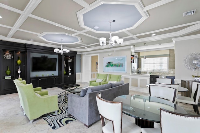 living room featuring coffered ceiling, ornamental molding, and a chandelier