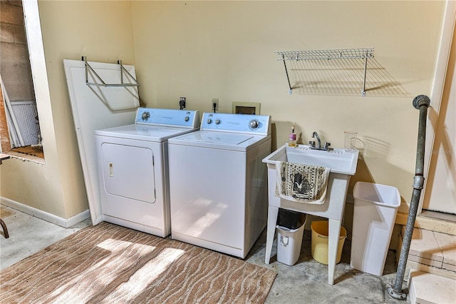 laundry area featuring washing machine and clothes dryer