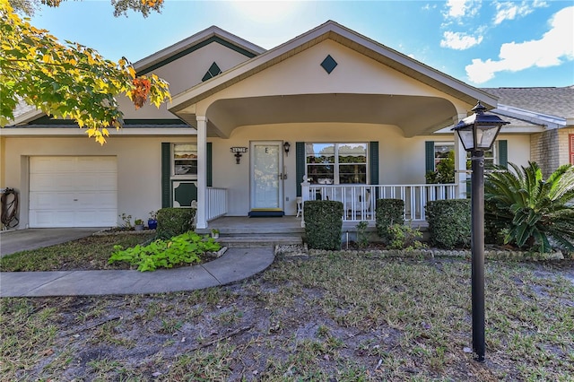 view of front of home featuring a porch and a garage