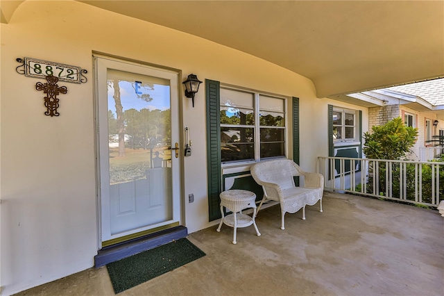 property entrance featuring a porch