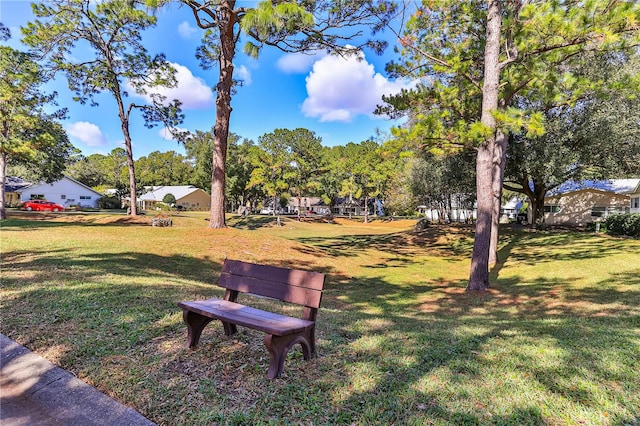 view of home's community with a yard