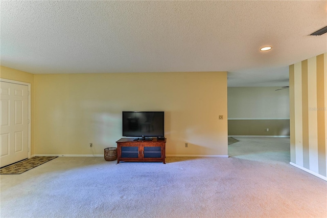 living room with light carpet and a textured ceiling