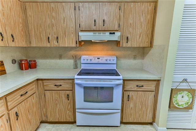 kitchen featuring backsplash, light brown cabinetry, light tile patterned flooring, and white electric range oven