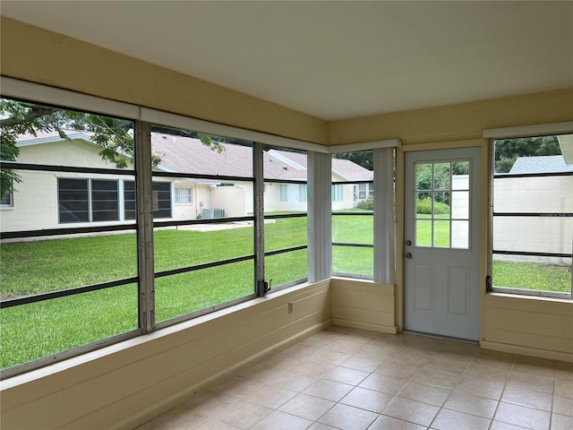 unfurnished sunroom featuring a healthy amount of sunlight