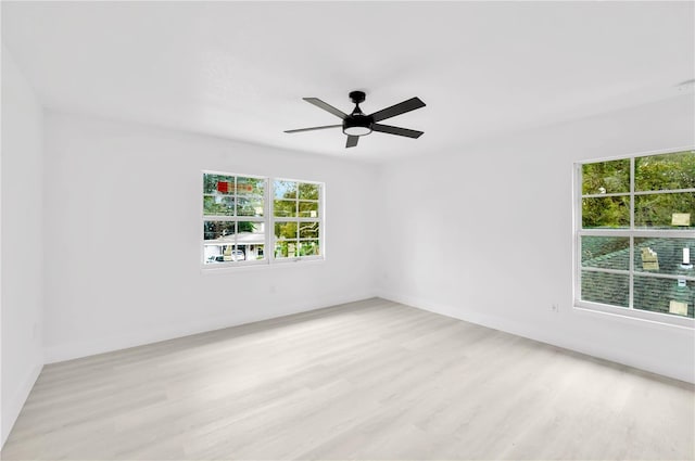 unfurnished room with ceiling fan and light hardwood / wood-style floors