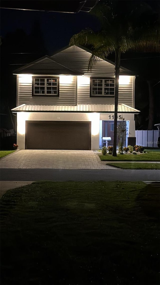 view of front of property featuring a garage