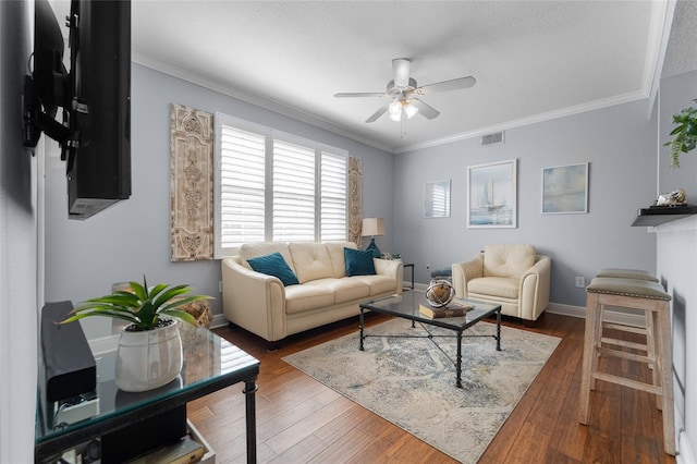 living room with ceiling fan, dark hardwood / wood-style floors, a textured ceiling, and ornamental molding