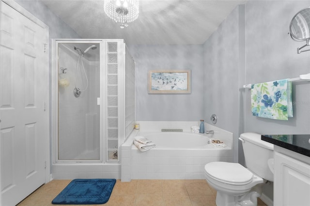 full bathroom with toilet, tile patterned flooring, vanity, a textured ceiling, and independent shower and bath