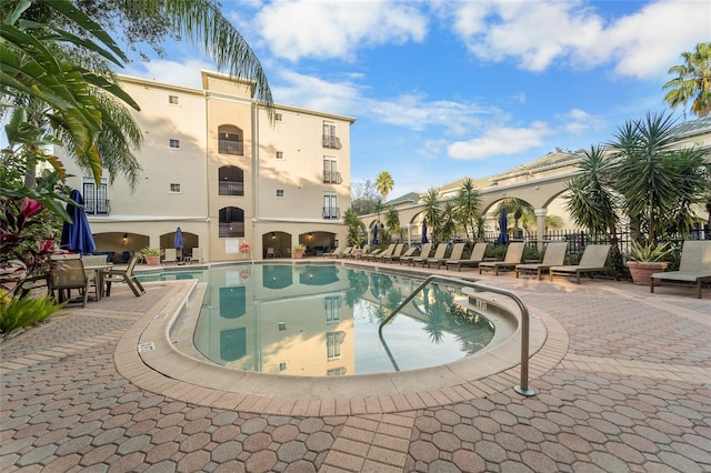 view of swimming pool with a patio