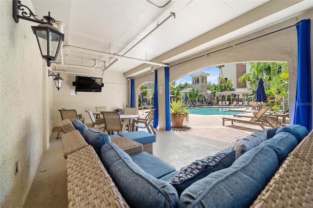 501 Knights Run Ave Unit 2120, Tampa, FL 33602 - view of patio featuring outdoor dining area and a community pool