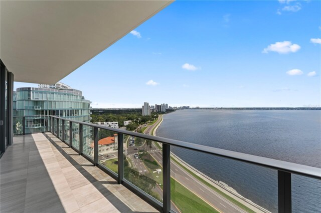 balcony featuring a water view