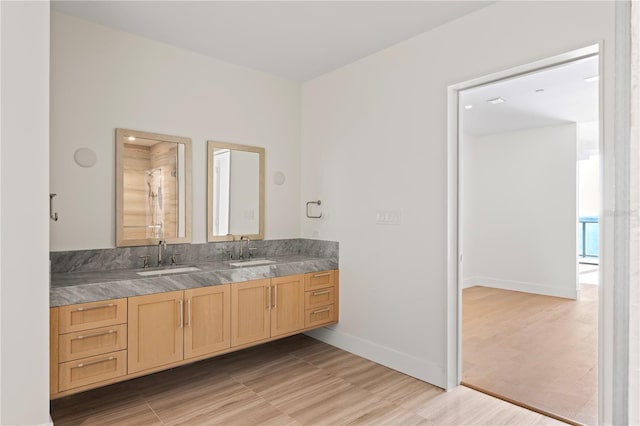 bathroom with vanity, hardwood / wood-style flooring, and walk in shower