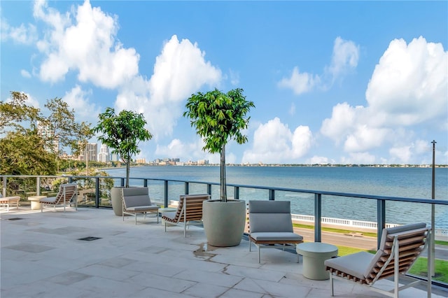 view of patio with a water view