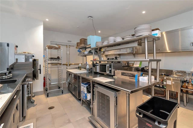 2912 Santiago St Unit 1201, Tampa, FL 33629 - kitchen with stainless steel countertops, stainless steel microwave, wine cooler, recessed lighting, and open shelves