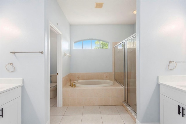 bathroom with visible vents, a stall shower, and vanity