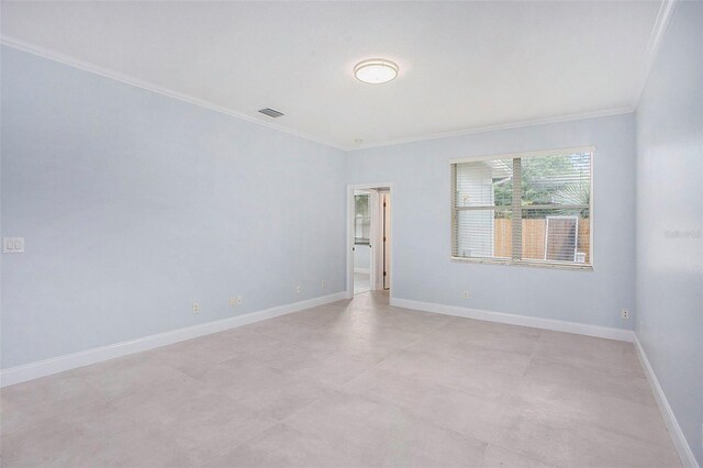 unfurnished room with ornamental molding